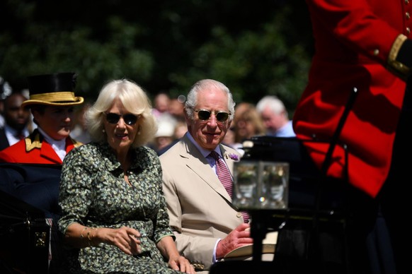 Britain s King Charles III and Britain s Queen Camilla arrive by horse carriage for a visit of the Sandringham Flower Show, in Sandrigham, north west England, on July 26, 2023., Credit:DANIEL LEAL / A ...
