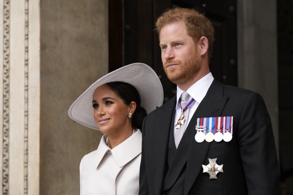 Prince Harry and Meghan Markle, Duke and Duchess of Sussex leave after a service of thanksgiving for the reign of Queen Elizabeth II at St Paul's Cathedral in London, Friday, June 3, 2022 on the secon ...