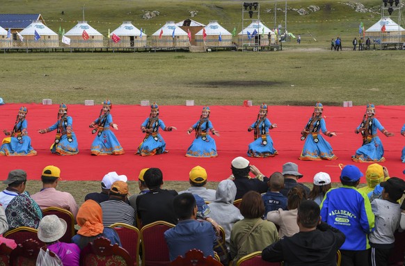 (180818) -- HEJING, Aug. 18, 2018 -- Dancers perform during a Nadam fair, which kicks off on Aug. 18, 2018, in Hejing County, northwest China s Xinjiang Uygur Autonomous Region. Nadam, meaning entertainment or recreation in Mongolian, is a folk festival of the Mongolian ethnic group. ) (ly) CHINA-XINJIANG-HEJING-NADAM FAIR-OPEN (CN) HuxHuhu PUBLICATIONxNOTxINxCHN 