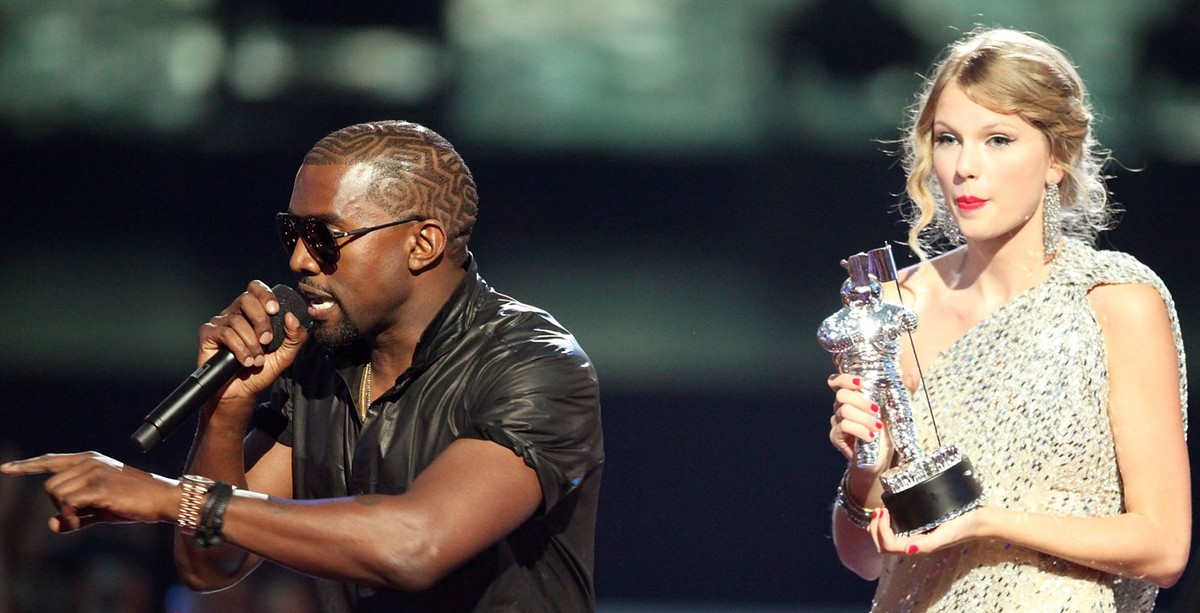 NEW YORK - SEPTEMBER 13: Kanye West (L) jumps onstage after Taylor Swift (C) won the "Best Female Video" award during the 2009 MTV Video Music Awards at Radio City Music Hall on September 13 ...