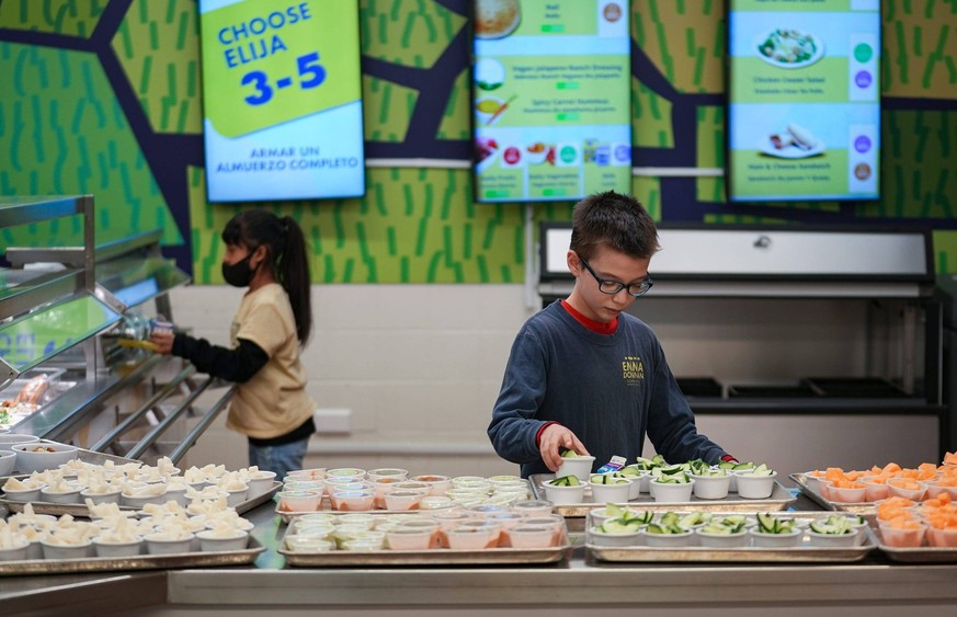 Syndication: The Indianapolis Star Students go through the lunch line Monday, Dec. 4, 2023, at Emma Donnan Elementary and Middle School in Indianapolis. Patachou Foundation s PataSchool Program, curre ...