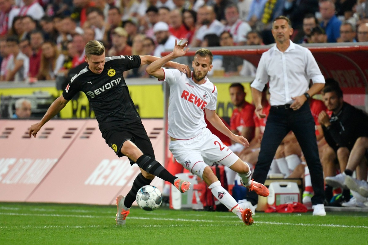 xuhx, Koeln, Rheinenergiestadion, 23.08.19, 1.Bundesliga - 2.Spieltag: 1.FC Koeln - Borussia Dortmund Bild: v. li. im Zweikampf Lukasz Piszczek (Dortmund) und Dominick Drexler (Koeln) Koeln *** xuhx,  ...