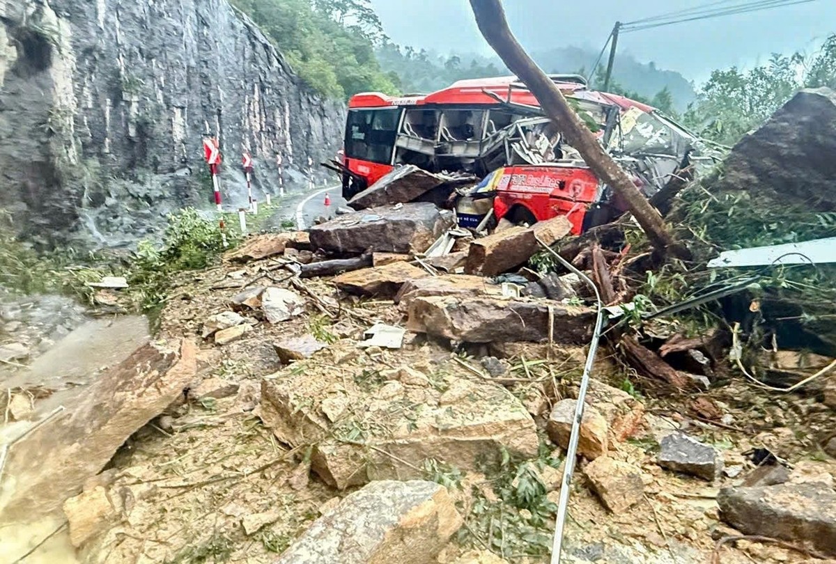 A passenger bus is crushed by a fatal landslide on Khanh Le pass in Khanh Hoa province, Vietnam, Monday, Nov. 17, 2025. (Minh Bang/VNExpress via AP)