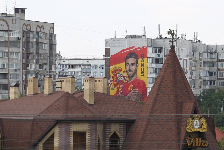 KRASNODAR, RUSSIA - JUNE 10, 2018: A graffiti featuring Spanish men s national football team player Sergio Ramos on an apartment block. The city of Krasnodar hosts the Spanish team during the 2018 FIF ...
