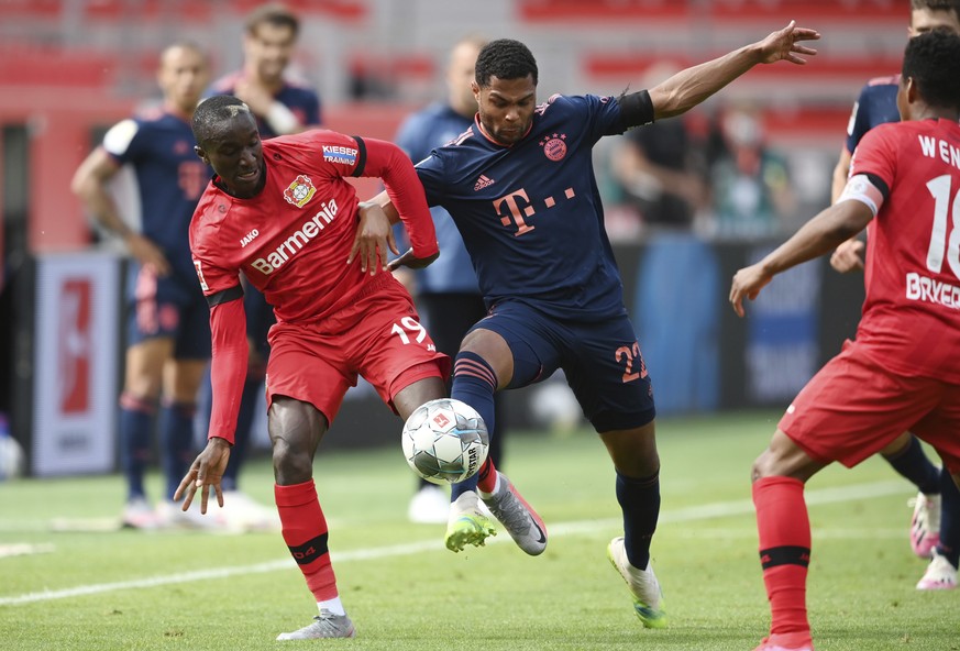 Serge Gnabry, right, from Munich in action against Moussa Diaby from Leverkusen during the German Bundesliga soccer match between Bayer Leverkusen and Bayern Munich in Leverkusen, Germany, Saturday, J ...