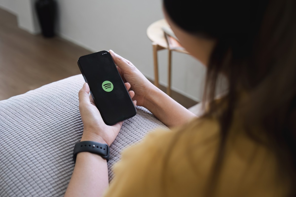 CHIANG MAI ,THAILAND DEC 15, 2023 : Apple iPhone14 smartphone with Spotify app on screen. Model Released Property Released xkwx music spotify apple editorial illustrative screen iphone logo streaming  ...