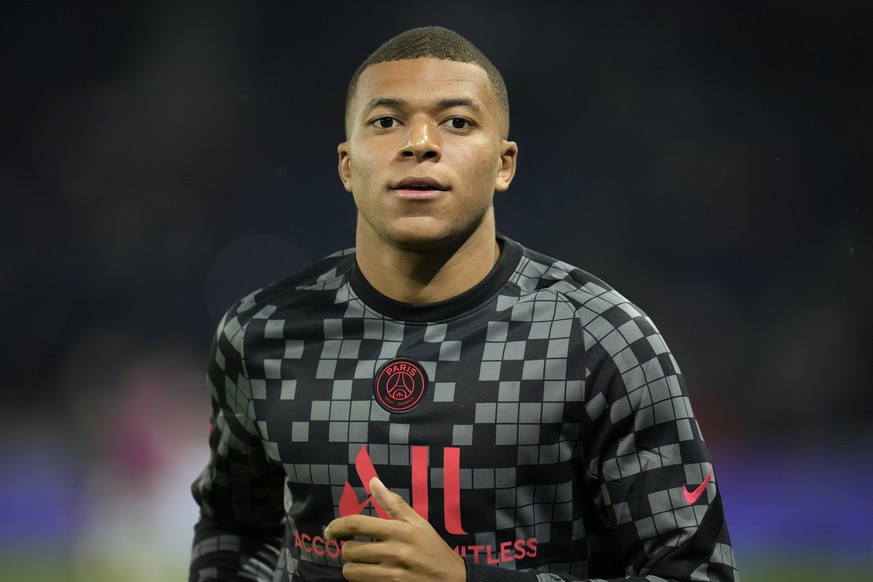 PSG&#039;s Kylian Mbappe exercises during warmup before the French League One soccer match between Paris Saint-Germain and Montpellier at the Parc des Princes stadium in Paris, Saturday, Sept. 25, 202 ...