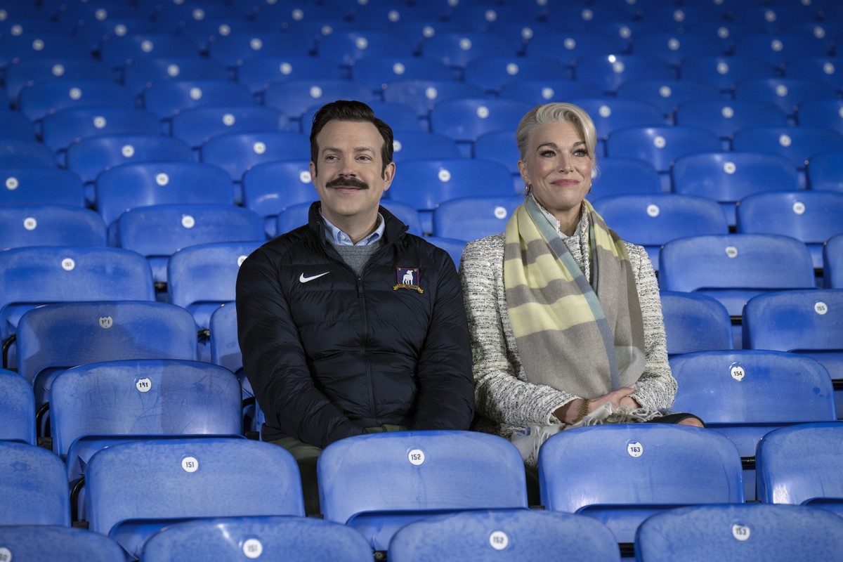 This image released by Apple TV shows Jason Sudeikis, left, and Hannah Waddingham in a scene from the season three finale of "Ted Lasso." (Colin Hutton/Apple TV via AP)