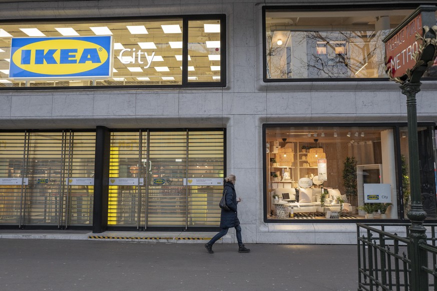 PARIS, FRANCE - MARCH 22: A women walk in front of Ikea City store at Madeleine, on March 22, 2021 in Paris, France. The trial of the French subsidiary of Ikea, accused in 2012 of having set up a syst ...