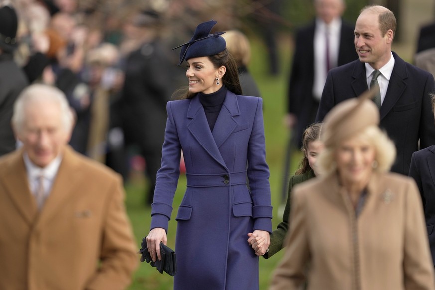 Britain&#039;s Kate, the Princess of Wales, William, the Prince of Wales, arrive behind King Charles III and Queen Camilla to attend the Christmas day service at St Mary Magdalene Church in Sandringha ...