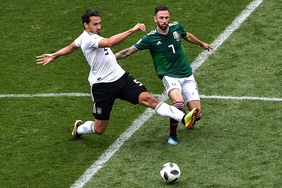 Miguel Layun of Mexico, right, challenges Mats Hummels of Germany in their Group F match during the FIFA World Cup WM Weltmeisterschaft Fussball 2018 in Moscow, Russia, 17 June 2018. Mexico hangs on t ...