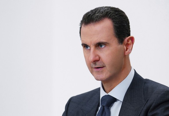 FILE - In this photo released on Nov. 9, 2019 by the Syrian official news agency SANA, Syrian President Bashar Assad speaks in Damascus, Syria. Security guards from the Syrian president&#039;s Baath p ...