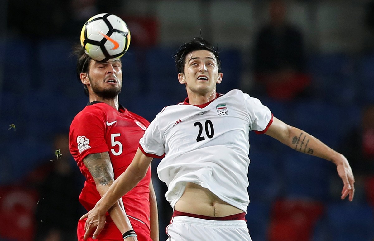 Soccer Football - International Friendly - Turkey vs Iran - Basaksehir Fatih Terim Stadium, Istanbul, Turkey - May 28, 2018 Turkey&#039;s Okay Yokuslu in action with Iran&#039;s Sardar Azmoun REUTERS/ ...