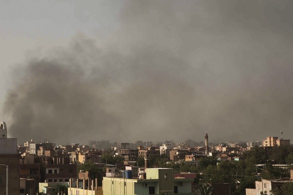 Smoke rises in Khartoum, Sudan, Saturday, April 29, 2023, as gunfire and heavy artillery fire continued despite the extension of a cease-fire between the country&#039;s two top generals. The battle fo ...