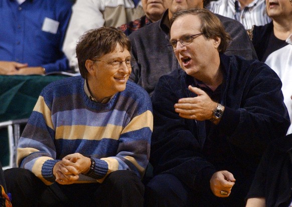 FILE - In this March 11, 2003 file photo, Microsoft Chairman Bill Gates, left, chats with Portland Trail Blazers owner and former business partner Paul Allen during a game between the Trail Blazers an ...