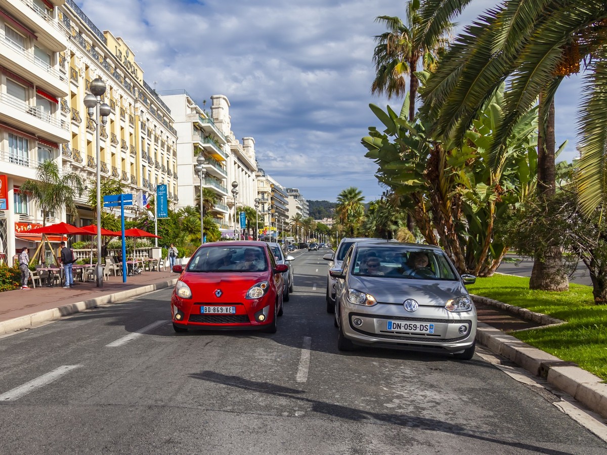 Nice, France, October 10, 2019. Urban view. Promenade des Anglais waterfront architectural ensemble. Cars go along the road