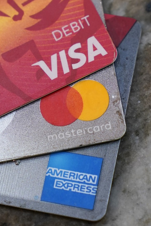 FILE - American Express, Visa and Master card cards are on display in Richmond, Va., Thursday, July 1, 2021. A group of Republican attorneys general are pushing the major payment networks _ Visa, Mast ...