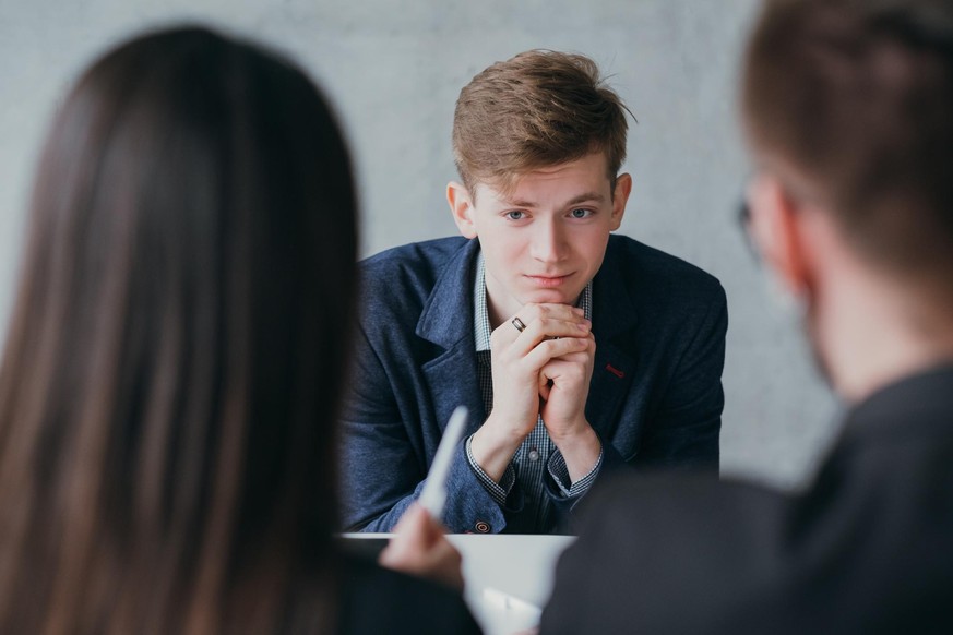 Stressful job interview. Professional career. Human resources. Young male applicant feeling nervous, needs to get the job.