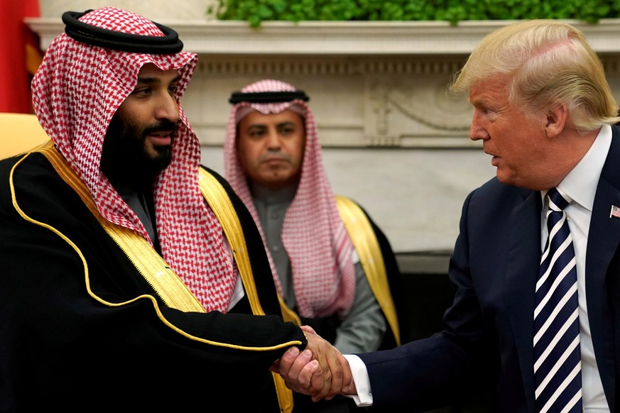 FILE PHOTO: U.S. President Donald Trump shakes hands with Saudi Arabia&#039;s Crown Prince Mohammed bin Salman in the Oval Office at the White House in Washington, U.S. March 20, 2018. REUTERS/Jonatha ...