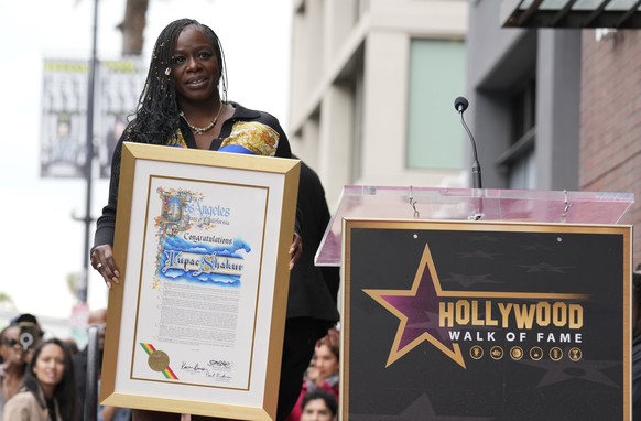 Sekyiwa &quot;Set&quot; Shakur holds a plaque at a ceremony honoring her brother, the late rapper and actor Tupac Shakur, with a star on the Hollywood Walk of Fame on Wednesday, June 7, 2023, in Los A ...