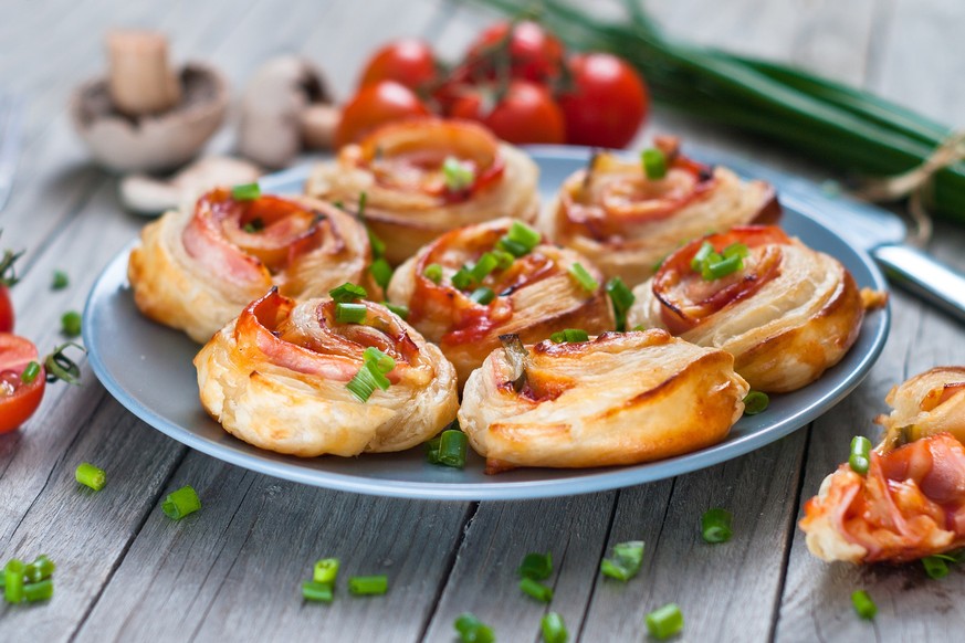 Puff pastry rolls. Baked snacks.