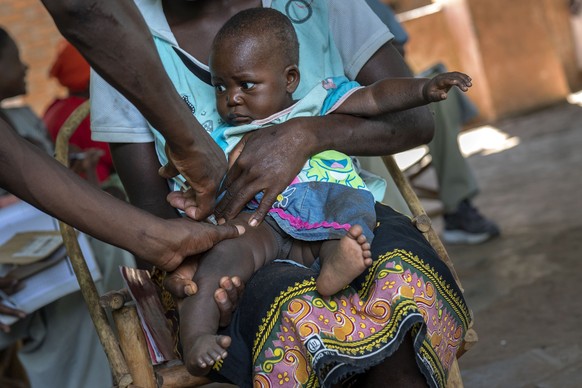 FILE - A baby from the Malawi village of Tomali is injected with the world&#039;s first vaccine against malaria in a pilot program, in Tomali, Dec. 11, 2019.The University of Oxford said Thursday Apri ...