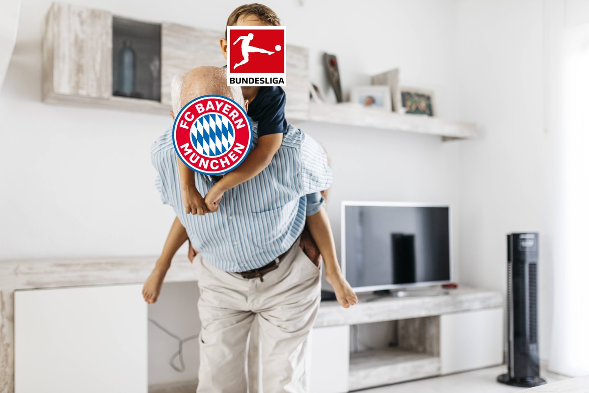 Portrait of grandfather giving his grandson a piggyback ride in the living room model released Symbolfoto property released PUBLICATIONxINxGERxSUIxAUTxHUNxONLY JRFF01817