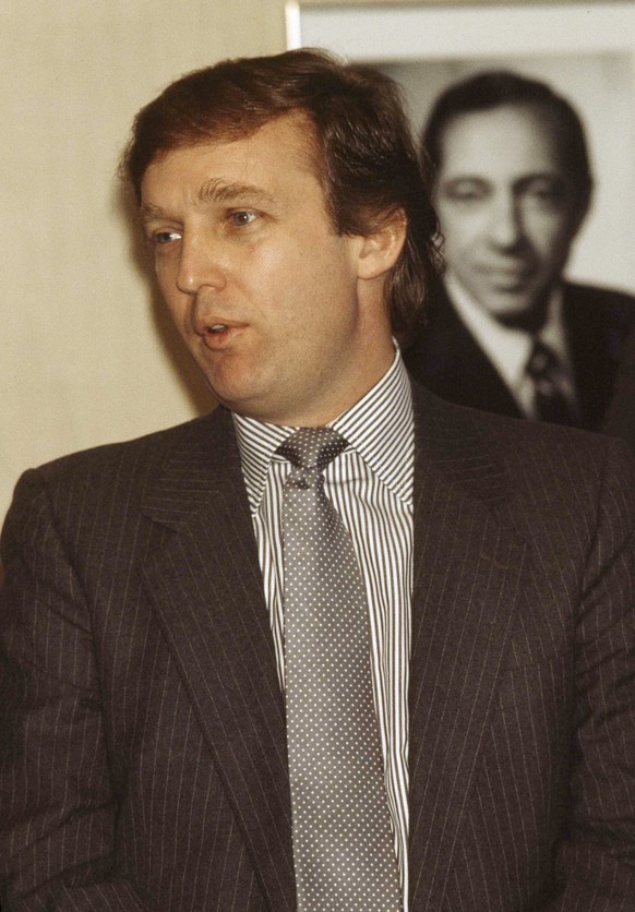 Real estate tycoon and owner of the New Jersey Generals football team speaks at a news conference about plans for a new sports stadium in New York City, Feb. 8, 1984. (AP Photo/Mario Suriani) |
