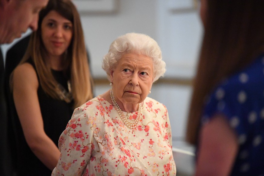 . 17/07/2019. London, United Kingdom. Queen Elizabeth II views an exhibition to mark the 200th anniversary of the birth of Queen Victoria for the Summer Opening of Buckingham Palace in London. PUBLICA ...