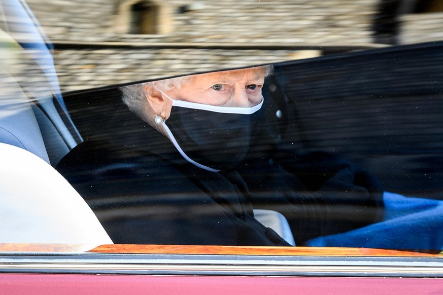 WINDSOR, ENGLAND - APRIL 17: Queen Elizabeth II during the funeral of Prince Philip, Duke of Edinburgh at Windsor Castle on April 17, 2021 in Windsor, England. Prince Philip of Greece and Denmark was  ...