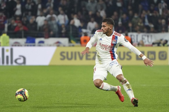FILE - Lyon's Houssem Aouar controls the ball during the French League One soccer match between Lyon and Monaco at the Groupama stadium in Lyon, France, Saturday, Oct. 16, 2021. French soccer clu ...