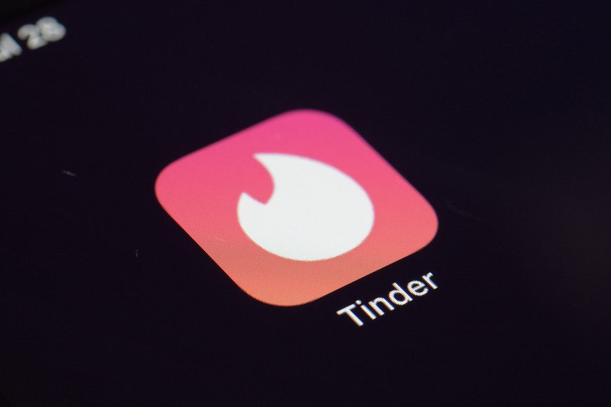 FILE - This July 28, 2020, file photo shows the icon for the Tinder dating app on a device in New York. According to a new study released Tuesday, Oct. 5, 2021, by Pew Research Center, the share of th ...