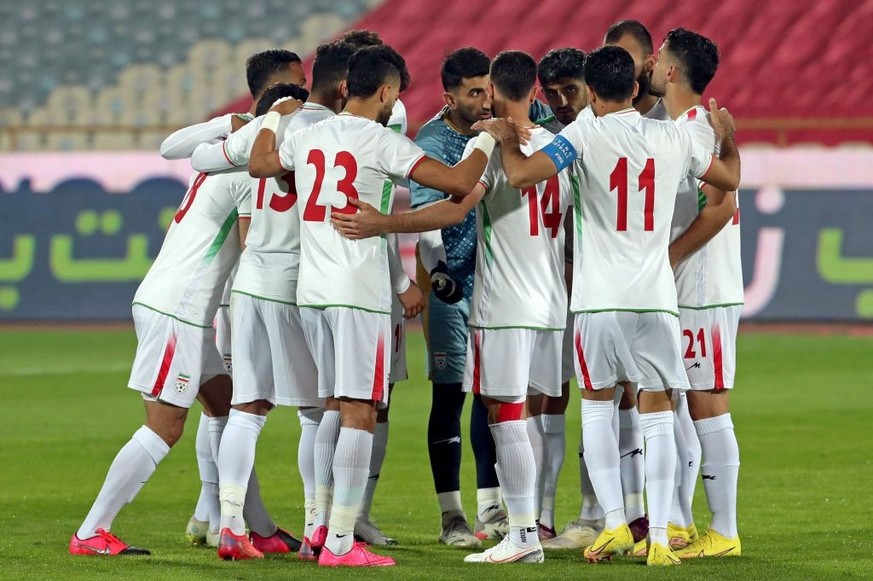 Iran&#039;s players gather in a huddle ahead of a friendly football match against Nicaragua at the Azadi stadium in Tehran, on November 10, 2022. (Photo by AFP) (Photo by -/AFP via Getty Images)