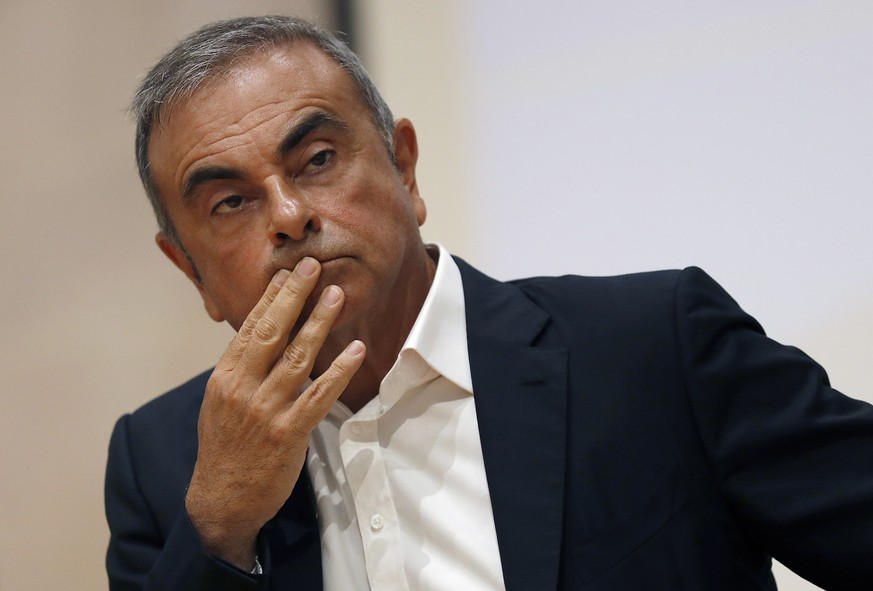 FILE - In this Sept. 29, 2020, file photo, former Nissan Motor Co. Chairman Carlos Ghosn holds a press conference at the Maronite Christian Holy Spirit University of Kaslik, as he launches an initiati ...