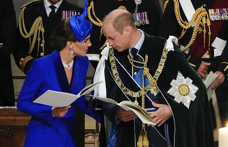 Britain&#039;s Prince William, the Prince of Wales, right and Kate, the Princess of Wales, known as the Duke and Duchess of Rothesay while in Scotland, speak, during the National Service of Thanksgivi ...