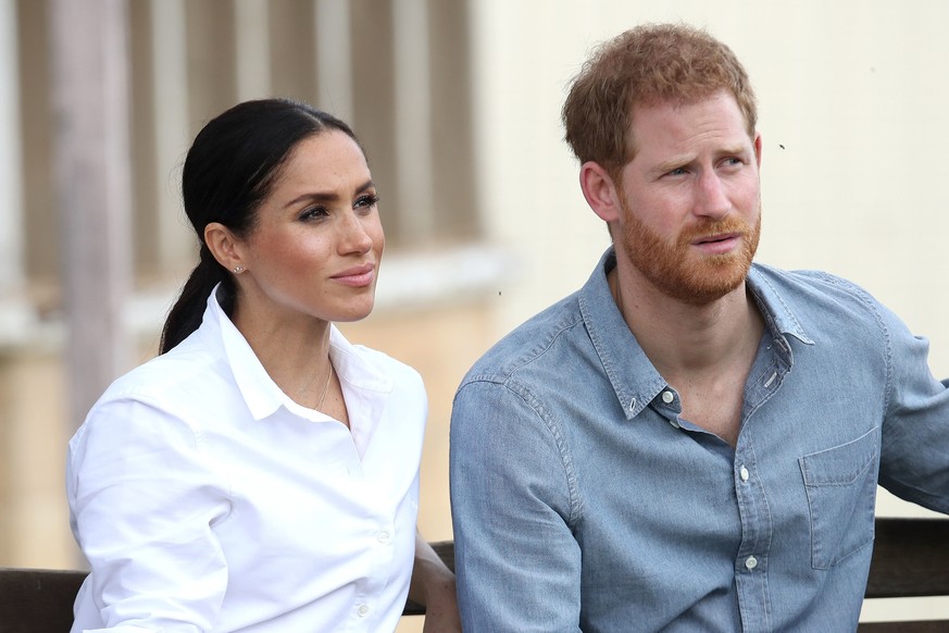 ARCHIV - 17.10.2018, Australien, Dubbo: Prinz Harry und Herzogin Meghan besuchen die Familie Woodley auf der von einer schweren D