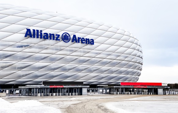 view of the exterior of the Allianz Arena in Munich on a cloudy day, Munich, DE, Dec 2022: view of the exterior of the Allianz Arena in Munich on a cloudy day. The membrane covering the stadium illumi ...