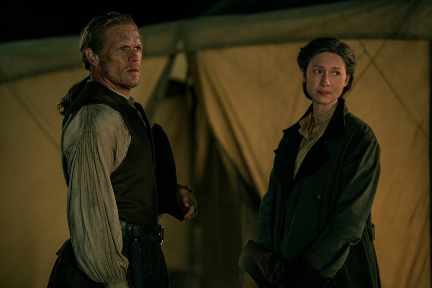 RECORD DATE NOT STATED OUTLANDER, from left: Sam Heughan, Caitriona Balfe, Turning Points , Season 7, ep. 708, aired Aug. 11, 2023. photo: Robert Wilson / Starz / Courtesy Everett Collection PUBLICATI ...