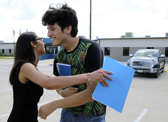U.S. citizen Francisco Galicia, 18, gets a hug from his attorney, Claudia Galan, after his release from the South Texas Detention Facility in Pearsall, Texas, Tuesday, July 23, 2019. Galicia was relea ...
