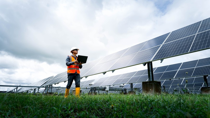 The solar farm(solar panel) with engineers check the operation of the system, Alternative energy to conserve the world&#039;s energy, Photovoltaic module idea for clean energy production.