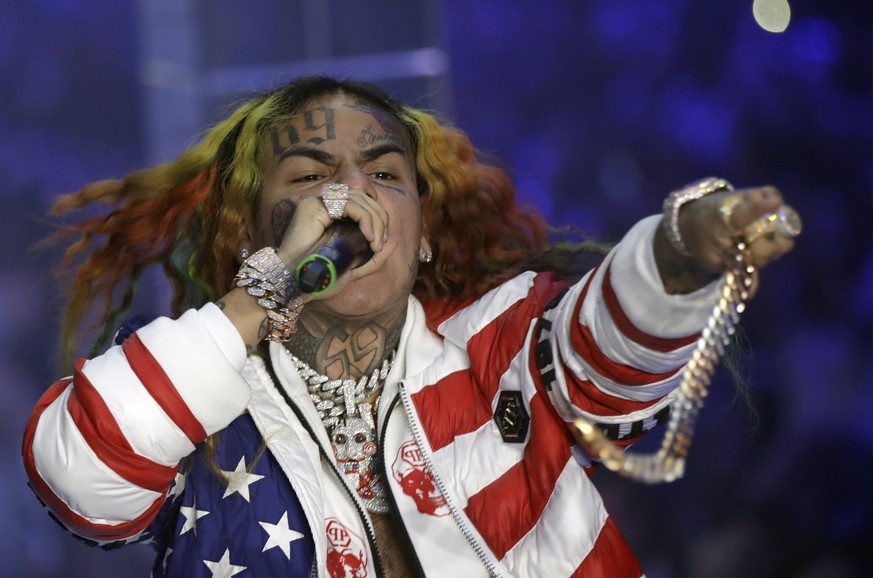 FILE- In this Sept. 21, 2018, file photo rapper Daniel Hernandez, known as Tekashi 6ix9ine, performs during the Philipp Plein women&#039;s 2019 Spring-Summer collection, unveiled during the Fashion We ...