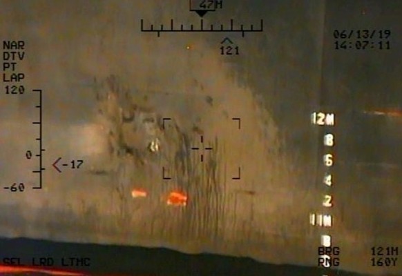 A U.S. military image released by the Pentagon in Washington on June 17, which the Pentagon says was taken from a U.S. Navy MH-60R helicopter, shows what the Navy says are the remnants of the magnetic ...