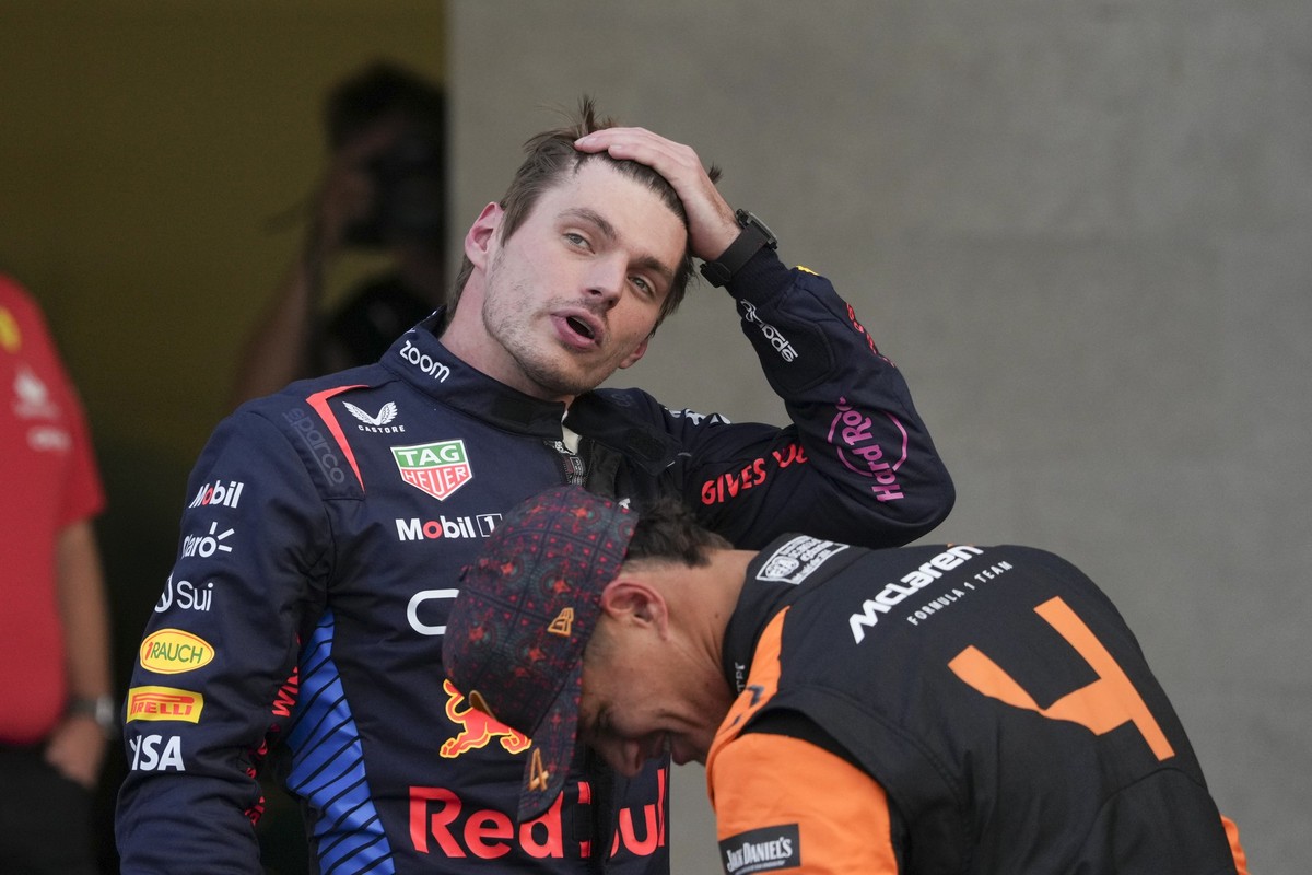 Second place Red Bull driver Max Verstappen, left, of the Netherlands, talks with third place McLaren driver Lando Norris, of Britain, at the end of a the qualifying session for the Formula One Mexico ...