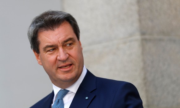 FILE PHOTO: Bavaria&#039;s Prime Minister Markus Soeder addresses a news conference after a joint Austrian and Bavarian cabinet meeting in Linz, Austria, June 20, 2018. REUTERS/Leonhard Foeger/File Ph ...