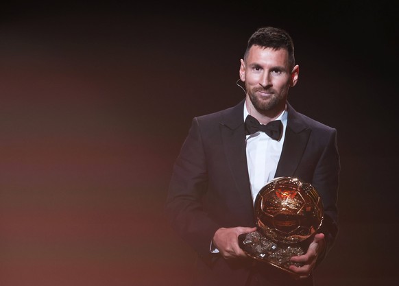 231031 -- PARIS, Oct. 31, 2023 -- Argentine forward Lionel Messi reacts on stage with his trophy as he receives his 8th Ballon d Or award during the 2023 Ballon d Or France Football award ceremony at  ...