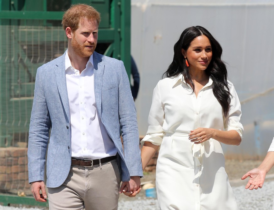 JOHANNESBURG, SOUTH AFRICA - OCTOBER 02: Prince Harry, Duke of Sussex and Meghan, Duchess of Sussex visit a township to learn about Youth Employment Services on October 02, 2019 in Johannesburg, South ...