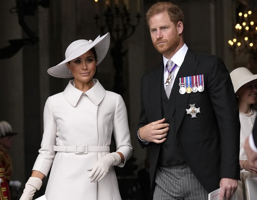 Prince Harry and Meghan Markle, Duke and Duchess of Sussex leave after a service of thanksgiving for the reign of Queen Elizabeth II at St Paul&#039;s Cathedral in London, Friday, June 3, 2022 on the  ...