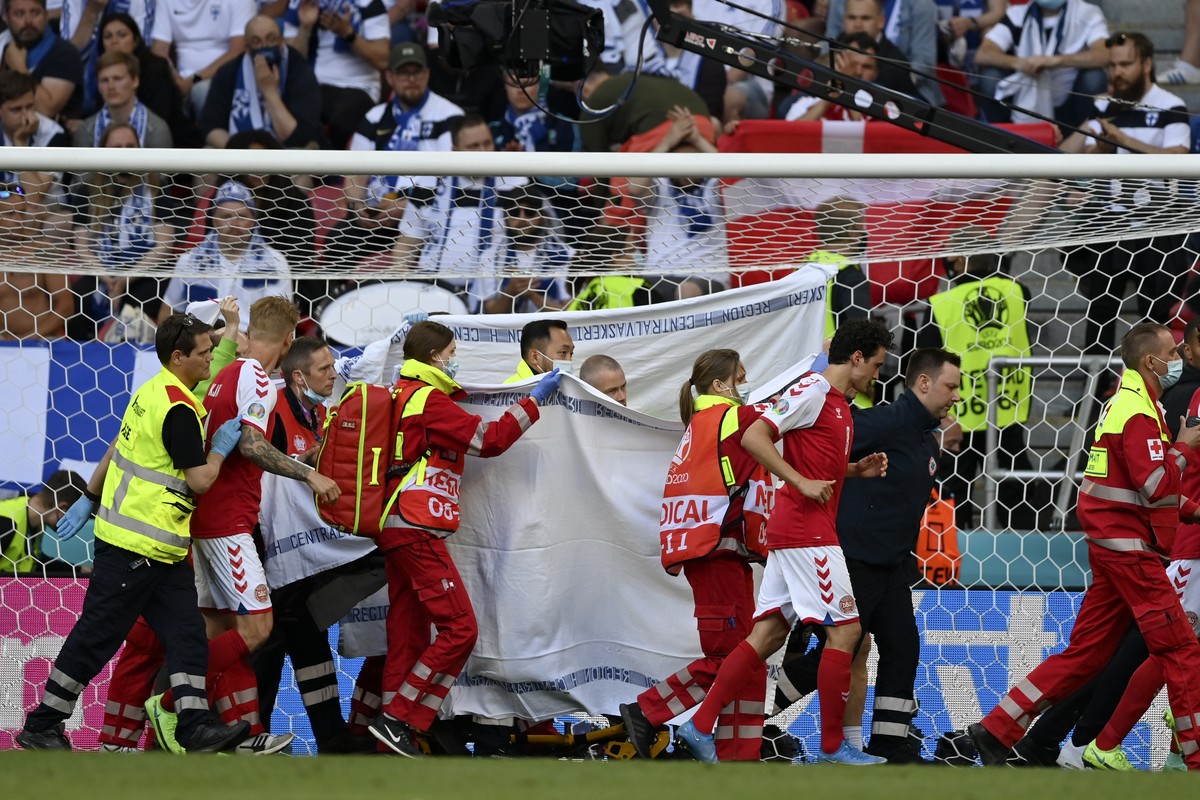 Denmark's Christian Eriksen is taken away on a stretcher after collapsing on the pitch during the Euro 2020 soccer championship group B match between Denmark and Finland at Parken Stadium in Cope ...