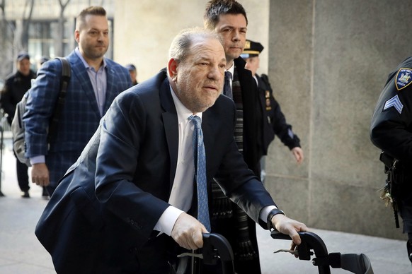 FILE - Harvey Weinstein arrives at a Manhattan courthouse as jury deliberations continue in his rape trial in New York, on Feb. 24, 2020. Opening statements are set to begin Monday in the disgraced mo ...