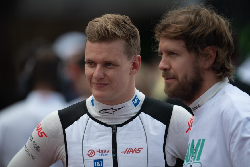 Miami Grand Prix - Race - Miami International Autodrome. (L to R): Mick Schumacher (GER) Haas F1 Team with Sebastian Vettel (GER) Aston Martin F1 Team on the grid. Miami Grand Prix, Sunday 8th May 202 ...